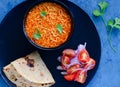 Gujarati cuisine main course-Sev tomato nu shak with roti Royalty Free Stock Photo