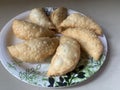 Gujiya or gujia or karanji - sweet dumplings. ndian snack made on diwali, holi and for celebrations .