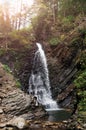 The Guk waterfall on the Zhenets river in the Carpathians. Waterfall on a mountain river. Beautiful natural background. Rest in Royalty Free Stock Photo