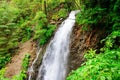 The Guk waterfall on the Zhenets river in the Carpathians. Waterfall on a mountain river. Beautiful natural background. Rest in Royalty Free Stock Photo