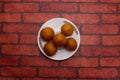 Gulab Jamun, gulapjaum, or Lalmohan sweet served in plate isolated on background top view of bangladeshi dessert food