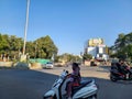 Stock photo of big solar street lamp stands tall at the center of a four-way intersection, as.