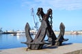 The Gulf of Finland on the background of an anchor on the embankment of Kronstadt. Royalty Free Stock Photo