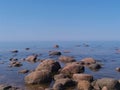 Gulf of Finland, cold northern Baltic Sea, Finland. The beauty of the northern summer. Sea, beach, large stones, horizon. Calm,