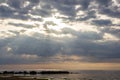 The Gulf of Finland before sunset, the rays of the sun pass through the overcast sky Royalty Free Stock Photo