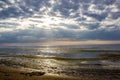 The Gulf of Finland before sunset, the rays of the sun pass through the overcast sky Royalty Free Stock Photo