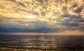 The Gulf of Finland before sunset, the rays of the sun pass through the overcast sky Royalty Free Stock Photo