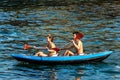 Man and woman on an inflatable kayak in the blue sea - Liguria Italy Royalty Free Stock Photo