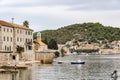 The gulf with medieval houses, cathedral and motor boats near the island of Vis, Croatia Royalty Free Stock Photo