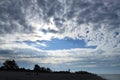 Storm clouds begin to clear over the Gulf of Mexico after the sunrise