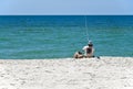 Young Man Fishing on the Beach at Gulf Shores Alabama
