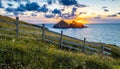 Gull rocks at sunset in Hollywell Bay in Cornwall