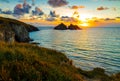 Gull rocks at sunset in Hollywell Bay in Cornwall Royalty Free Stock Photo