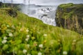 Gullfoss also known as Golden Falls waterfall and green foloage in foreground. Iceland Royalty Free Stock Photo
