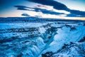 Frozen Gullfoss Falls in Iceland in winter at sunset.