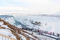 GULLFOSS, ICELAND - March 4, 2020: Tourists at the observation deck look at Gullfoss waterfall in Iceland