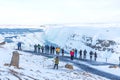 GULLFOSS, ICELAND - March 4, 2020: Tourists at the observation deck look at Gullfoss waterfall in Iceland