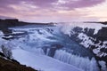 Gullfoss waterfall in Iceland. Beautiful grand waterfall at dramatic sunset, in early spring or winter. Royalty Free Stock Photo