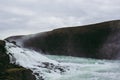 Gullfoss waterfall`s cascades on a cold cloudy spring afternoon Royalty Free Stock Photo