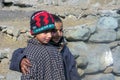 Two Kashmiri children wear traditional dress Pheran
