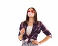 Young cute girl chews bubble gum, isolated