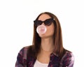 Young cute girl chews bubble gum, isolated