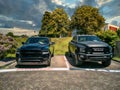 Two Dodge Ram pickup trucks are for sale at a car dealership in Gummersbach Royalty Free Stock Photo