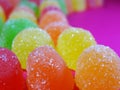 Gummies candy on a ondulated pattern closeup Royalty Free Stock Photo