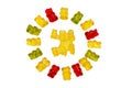 Gummy bears. Circle of fruity gummy bears with rainbow colors isolated on white. In the middle of the circle is a manufacturing