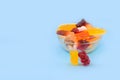 Gummy bears in a plate on a blue background Royalty Free Stock Photo