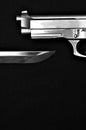 Gun above knife Royalty Free Stock Photo