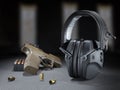 Gun and ammo with hearing protection Royalty Free Stock Photo