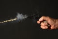 Gun being fired Royalty Free Stock Photo