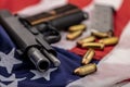 Gun and bullets on an american flag background Royalty Free Stock Photo