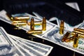 Gun and bullets on dollar banknotes background Royalty Free Stock Photo