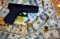 Gun and bullets on dollar and euro banknotes background Royalty Free Stock Photo