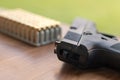 Gun with bullets. Handgun box with new ammunition. Royalty Free Stock Photo