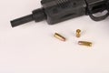 Gun and bullets on a white background Royalty Free Stock Photo