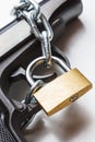 The gun, chain and closed padlock Royalty Free Stock Photo