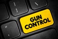 Gun control - set of laws that regulate the manufacture, sale, transfer, possession, or use of firearms by civilians, text concept