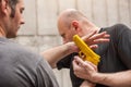 Gun Disarm. Self defense techniques against a gun point. Royalty Free Stock Photo