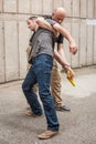 Gun Disarm. Self defense techniques against a gun point. Royalty Free Stock Photo