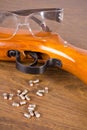 Gun, a few bullets and glasses Royalty Free Stock Photo