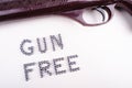 Gun free zone title made of bullets with rifle