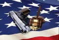 Gun with Gavel and Bullets on American Flag Royalty Free Stock Photo