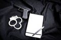 gun, handcuffs and notebook Royalty Free Stock Photo