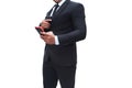 A gun man in black suit is holding a pistol and his other hand on a white background Royalty Free Stock Photo