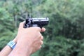 Gun in man hand Royalty Free Stock Photo