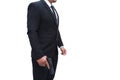 A gun man side view in a black suit standing with a pistol in a stern pose, on a white background. Concept for assassin, Royalty Free Stock Photo