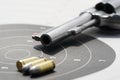 gun with 9mm bullets on the target Royalty Free Stock Photo